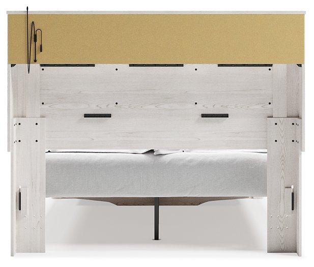 Altyra White Queen Upholstered Bookcase Bed with Storage